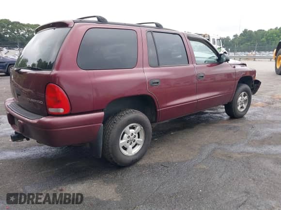 2002 Dodge Durango Sport with VIN 1B4HS38N32F206649, listed as a IAAI auction lot 40725627 with 290,822 mi miles and . Bid and sale history available at DreamBid. Image 4.