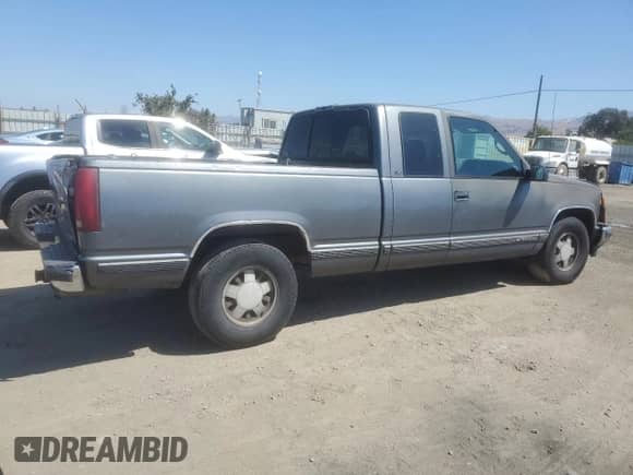1999 Chevrolet Silverado 1500 with VIN 1GCEC19R6XR141245, listed as a Copart auction lot 65626765 with 340,888 mi miles and Salvage title. Bid and sale history available at DreamBid. Image 3.