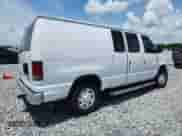 2013 Ford Econoline Cargo Commercial with VIN 1FTNE2EW1DDA46709, listed as a Copart auction lot 64098505 with 194,401 mi miles and Salvage title. Bid and sale history available at DreamBid. Image 3.