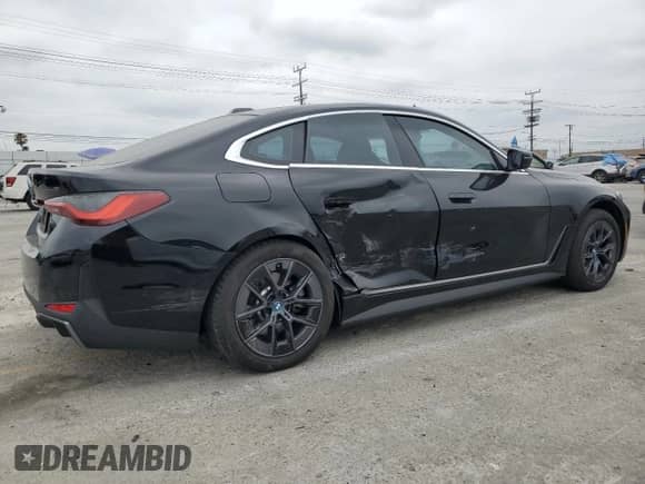 2024 BMW i4 eDrive35 with VIN WBY43AW05RFS57427, listed as a Copart auction lot 65464855 with 7,096 mi miles and Salvage title. Bid and sale history available at DreamBid. Image 3.