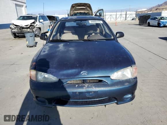 1999 Hyundai Accent L z VIN KMHVD14N3XU456921, wystawiony jako Copart lot #44805175 z przebiegiem 112 134 mil mil oraz Czysty tytuł • Clean title. Historia ofert i sprzedaży dostępna na DreamBid. Obrazek 5.