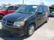 2014 Dodge Grand Caravan SXT 30th Anniversary with VIN 2C4RDGCG7ER392484, listed as a IAAI auction lot 42842133 with 163,973 mi miles and . Bid and sale history available at DreamBid. Image 2.