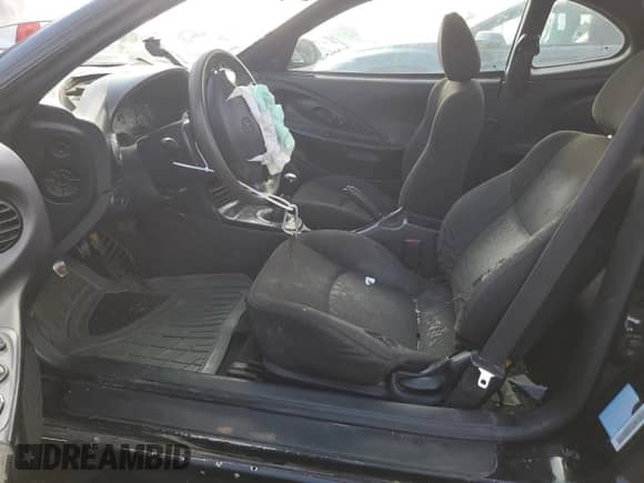 2001 Hyundai Tiburon с VIN KMHJG25F21U250094, выставлен на аукционе Copart как лот 58390024 с пробегом 175 615 миль миль и Списание • Salvage title. История ставок и продаж доступна на DreamBid. Изображение 7.
