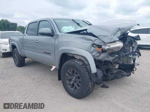 2021 Toyota Tacoma SR5 z VIN 3TMDZ5BN7MM106221, wystawiony jako IAAI lot #42827931 z przebiegiem 71 851 mil mil oraz . Historia ofert i sprzedaży dostępna na DreamBid. Obrazek 1.