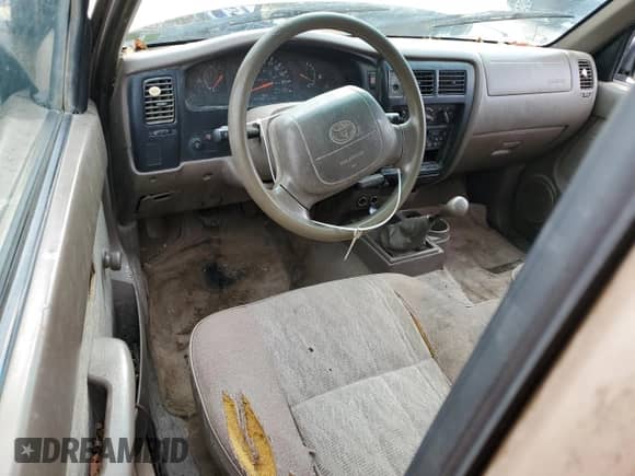 1999 Toyota Tacoma z VIN 4TAVL52N3XZ539894, wystawiony jako Copart lot #81200825 z przebiegiem 179 121 mil mil oraz Szkoda całkowita • Salvage title. Historia ofert i sprzedaży dostępna na DreamBid. Obrazek 8.