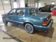 1994 Dodge Spirit with VIN 3B3AA4638RT310022, listed as a Copart auction lot 63479515 with 157,435 mi miles and Salvage title. Bid and sale history available at DreamBid. Image 2.
