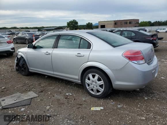 2009 Saturn Aura XE with VIN 1G8ZS57B89F155969, listed as a Copart auction lot 63835245 with 113,883 mi miles and Salvage title. Bid and sale history available at DreamBid. Image 2.