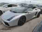 2007 Lamborghini Gallardo с VIN ZHWGU22T57LA05137, выставлен на аукционе Copart как лот 76275354 с пробегом Не указан миль и Списание • Salvage title. История ставок и продаж доступна на DreamBid. Изображение 1.