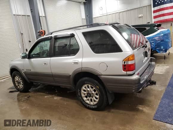 2001 Honda Passport LX with VIN 4S6DM58W814406889, listed as a Copart auction lot 84244735 with 158,711 mi miles and Clean title. Bid and sale history available at DreamBid. Image 2.