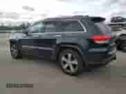 2016 Jeep Grand Cherokee Overland with VIN 1C4RJFCG6GC489769, listed as a Copart auction lot 82302855 with 136,225 mi miles and Salvage title. Bid and sale history available at DreamBid. Image 2.