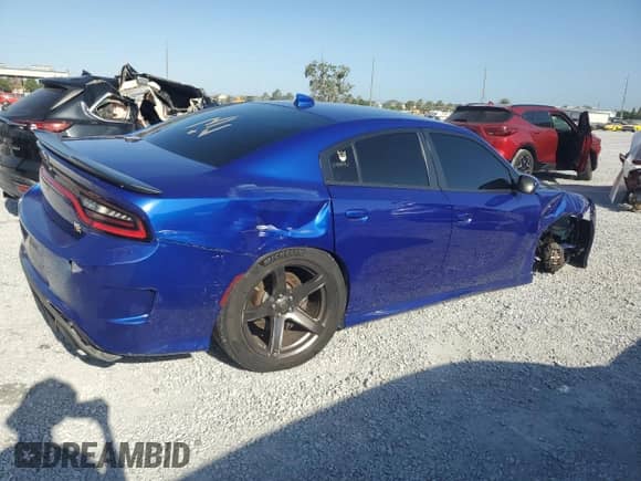 2019 Dodge Charger Scat Pack с VIN 2C3CDXGJ1KH740166, выставлен на аукционе Copart как лот 54598135 с пробегом 82 246 миль миль и Списание • Salvage title. История ставок и продаж доступна на DreamBid. Изображение 3.