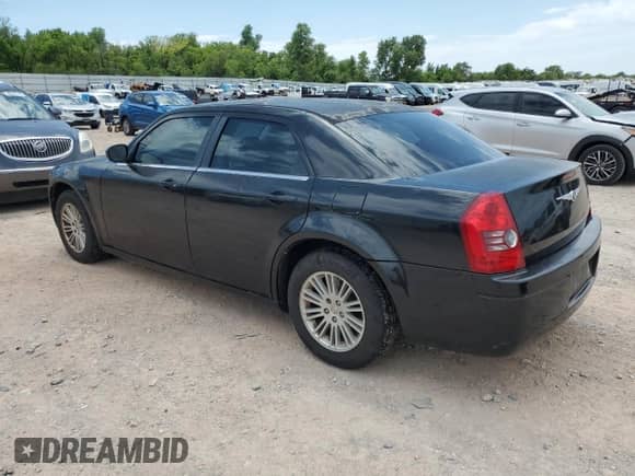 2009 Chrysler 300 LX with VIN 2C3KA43D19H500516, listed as a Copart auction lot 66175875 with 179,265 mi miles and Salvage title. Bid and sale history available at DreamBid. Image 2.