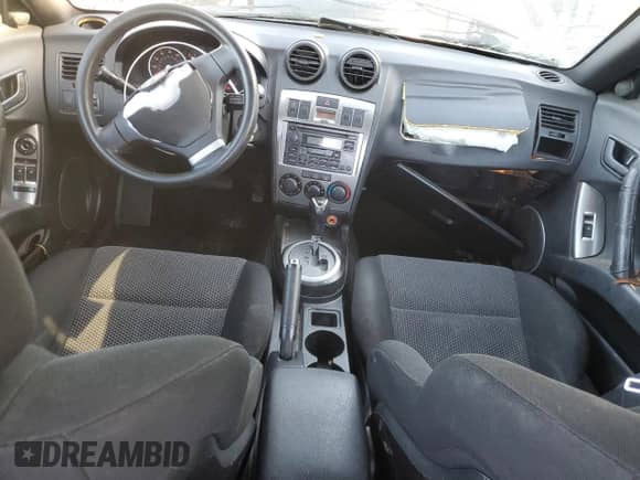 2004 Hyundai Tiburon GS with VIN KMHHM65DX4U153243, listed as a Copart auction lot 87869805 with 177,398 mi miles and Salvage title. Bid and sale history available at DreamBid. Image 8.