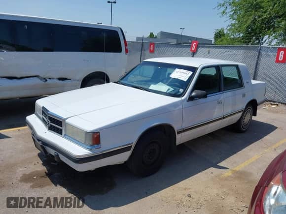 1992 Dodge Dynasty LE with VIN 1B3XC56RXND723509, listed as a IAAI auction lot 42769093 with 99,589 mi miles and . Bid and sale history available at DreamBid. Image 2.