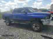 2001 Dodge 2500 with VIN 3B7KF236X1G197808, listed as a Copart auction lot 72450104 with 350,953 mi miles and Salvage title. Bid and sale history available at DreamBid. Image 4.