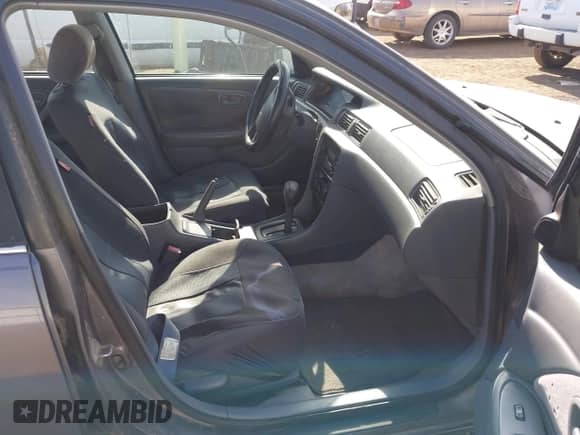 1999 Toyota Camry LE z VIN JT2BG22K4X0271967, wystawiony jako IAAI lot #42464880 z przebiegiem 200 314 mil mil oraz . Historia ofert i sprzedaży dostępna na DreamBid. Obrazek 5.