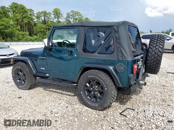 1999 Jeep Wrangler Sport with VIN 1J4FY19S7XP435204, listed as a Copart auction lot 83820835 with 263,738 mi miles and Clean title. Bid and sale history available at DreamBid. Image 2.