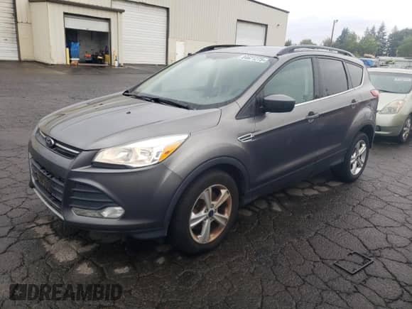 2014 Ford Escape SE with VIN 1FMCU0G96EUC60713, listed as a Copart auction lot 84621275 with 138,146 mi miles and Clean title. Bid and sale history available at DreamBid. Image 1.