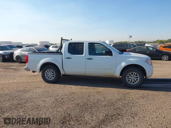2016 Nissan Frontier SV z VIN 1N6AD0EV5GN726475, wystawiony jako IAAI lot #40481044 z przebiegiem 55 910 mil mil oraz . Historia ofert i sprzedaży dostępna na DreamBid. Obrazek 13.