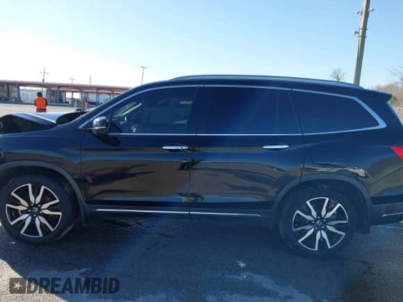 2020 Honda Pilot Touring 7-Passenger z VIN 5FNYF5H64LB006073, wystawiony jako IAAI lot #41750282 z przebiegiem 73 214 mil mil oraz . Historia ofert i sprzedaży dostępna na DreamBid. Obrazek 14.