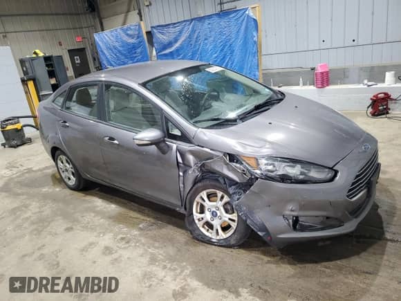 2014 Ford Fiesta SE with VIN 3FADP4BJ8EM194670, listed as a Copart auction lot 69234035 with 106,806 mi miles and Salvage title. Bid and sale history available at DreamBid. Image 4.