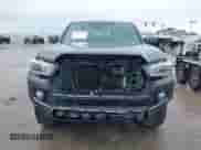 2021 Toyota Tacoma SR5 with VIN 5TFAZ5CNXMX097509, listed as a IAAI auction lot 41889399 with 81,598 mi miles and . Bid and sale history available at DreamBid. Image 6.
