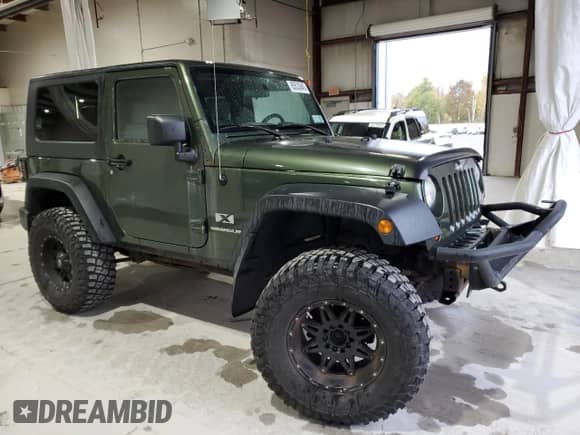 2009 Jeep Wrangler X с VIN 1J4FA24169L708281, выставлен на аукционе Copart как лот 85533845 с пробегом 83 553 миль миль и Списание • Salvage title. История ставок и продаж доступна на DreamBid. Изображение 4.