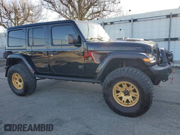2023 Jeep Wrangler Rubicon 392 with VIN 1C4JJXSJ3PW694447, listed as a Copart auction lot 49426255 with 22,709 mi miles and Salvage title. Bid and sale history available at DreamBid. Image 4.