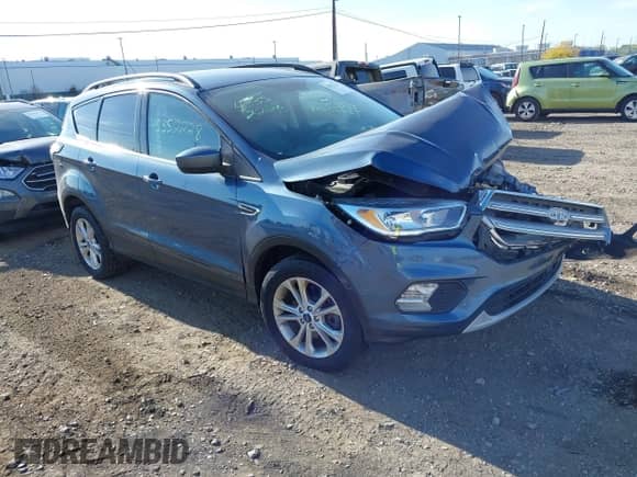 2018 Ford Escape SE with VIN 1FMCU9GD3JUB69434, listed as a IAAI auction lot 43352228 with 63,274 mi miles and . Bid and sale history available at DreamBid. Image 1.