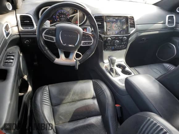 2020 Jeep Grand Cherokee SRT with VIN 1C4RJFDJ8LC158048, listed as a Copart auction lot 57426205 with 52,979 mi miles and Salvage title. Bid and sale history available at DreamBid. Image 8.