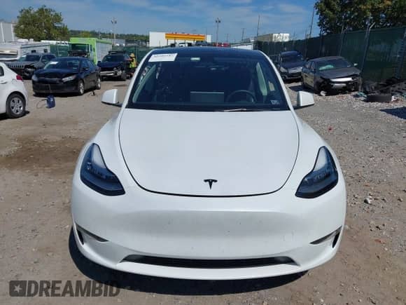 2023 Tesla Model Y Long Range with VIN 7SAYGDEE9PA033911, listed as a IAAI auction lot 43202182 with 35,938 mi miles and . Bid and sale history available at DreamBid. Image 12.