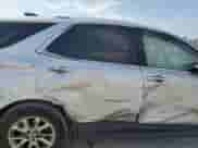 2018 Chevrolet Equinox LT z VIN 2GNAXJEV9J6283752, wystawiony jako Copart lot #71990665 z przebiegiem Nie podano mil oraz Szkoda całkowita • Salvage title. Historia ofert i sprzedaży dostępna na DreamBid. Obrazek 11.