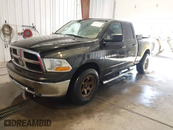 2011 Ram 1500 Big Horn with VIN 1D7RB1GT2BS669617, listed as a IAAI auction lot 43242457 with 141,848 mi miles and . Bid and sale history available at DreamBid. Image 2.