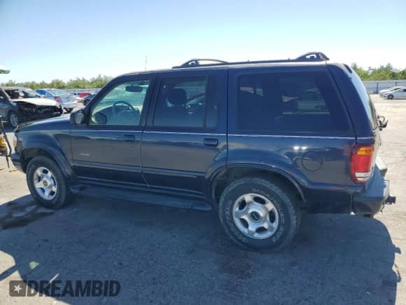 2000 Ford Explorer Limited with VIN 1FMDU75E0YZA21422, listed as a Copart auction lot 63618475 with 141,942 mi miles and Salvage title. Bid and sale history available at DreamBid. Image 2.