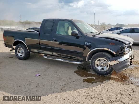 1999 Ford F-150 with VIN 1FTRX17W3XNB91574, listed as a Copart auction lot 84773145 with Not provided miles and Salvage title. Bid and sale history available at DreamBid. Image 4.