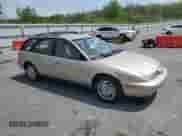1999 Saturn SW with VIN 1G8ZJ827XXZ323713, listed as a Copart auction lot 55183385 with 166,834 mi miles and Salvage title. Bid and sale history available at DreamBid. Image 4.