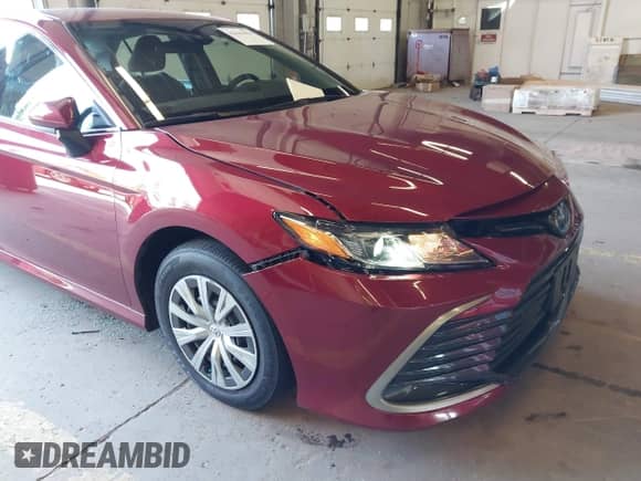 2022 Toyota Camry Hybrid LE with VIN 4T1C31AK7NU585634, listed as a IAAI auction lot 42443856 with 31,756 mi miles and . Bid and sale history available at DreamBid. Image 6.