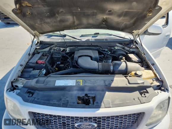 2003 Ford F-150 XL z VIN 2FTRX17L63CB07124, wystawiony jako Copart lot #86682935 z przebiegiem 101 788 mil mil oraz Szkoda całkowita • Salvage title. Historia ofert i sprzedaży dostępna na DreamBid. Obrazek 11.