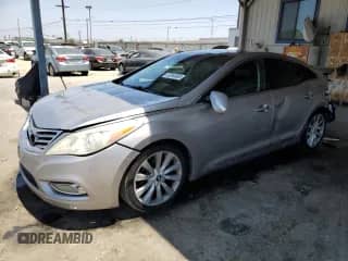 2012 Hyundai Azera с VIN KMHFH4JG8CA191831, выставлен на аукционе Copart как лот 63348985 с пробегом 189 389 миль миль и Списание • Salvage title. История ставок и продаж доступна на DreamBid. Изображение 1.