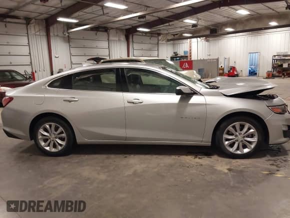 2019 Chevrolet Malibu LT z VIN 1G1ZD5ST9KF144705, wystawiony jako IAAI lot #43308447 z przebiegiem 91 726 mil mil oraz . Historia ofert i sprzedaży dostępna na DreamBid. Obrazek 13.