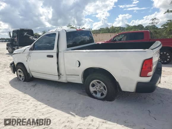 2012 Ram 1500 Tradesman with VIN 3C6JD6AT0CG124510, listed as a Copart auction lot 82440575 with 146,407 mi miles and Salvage title. Bid and sale history available at DreamBid. Image 2.