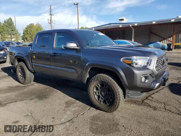 2023 Toyota Tacoma SR with VIN 3TMCZ5ANXPM559511, listed as a Copart auction lot 80508385 with 33,176 mi miles and Salvage title. Bid and sale history available at DreamBid. Image 4.