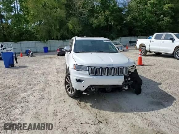 2017 Jeep Grand Cherokee Overland with VIN 1C4RJFCGXHC964499, listed as a Copart auction lot 71671795 with 117,302 mi miles and Salvage title. Bid and sale history available at DreamBid. Image 15.