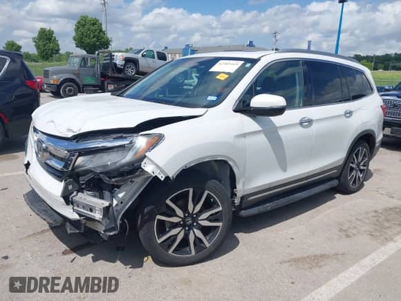 2020 Honda Pilot Touring 7-Passenger z VIN 5FNYF5H65LB021861, wystawiony jako IAAI lot #42305419 z przebiegiem 118 595 mil mil oraz . Historia ofert i sprzedaży dostępna na DreamBid. Obrazek 19.