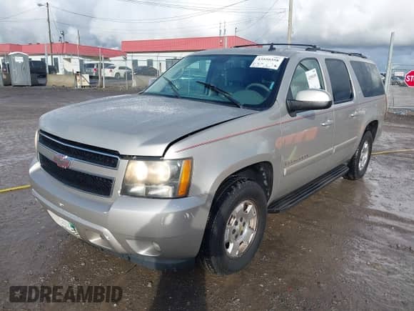 2009 Chevrolet Suburban 2LT z VIN 1GNFC26029R231745, wystawiony jako IAAI lot #43550358 z przebiegiem 388 966 mil mil oraz . Historia ofert i sprzedaży dostępna na DreamBid. Obrazek 2.