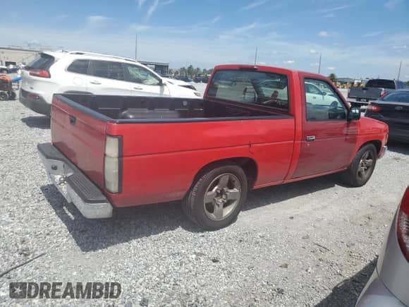 1997 Nissan Frontier XE with VIN 1N6SD11S5VC384265, listed as a Copart auction lot 62367885 with 186,882 mi miles and Salvage title. Bid and sale history available at DreamBid. Image 3.