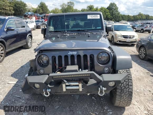 2016 Jeep Wrangler Sport with VIN 1C4AJWAG6GL194879, listed as a Copart auction lot 71034895 with 103,769 mi miles and Salvage title. Bid and sale history available at DreamBid. Image 5.