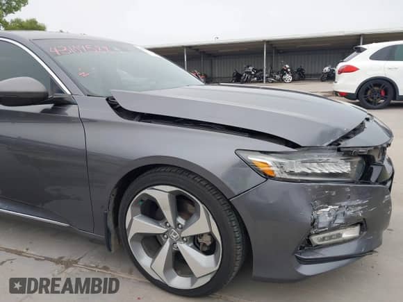 2018 Honda Accord Touring z VIN 1HGCV1F95JA100229, wystawiony jako IAAI lot #43109588 z przebiegiem 129 307 mil mil oraz . Historia ofert i sprzedaży dostępna na DreamBid. Obrazek 19.