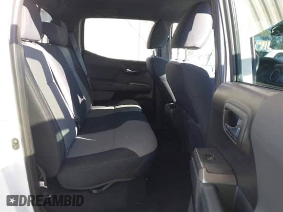 2021 Toyota Tacoma SR5 z VIN 3TMAZ5CN7MM144212, wystawiony jako IAAI lot #41707150 z przebiegiem 75 113 mil mil oraz . Historia ofert i sprzedaży dostępna na DreamBid. Obrazek 8.