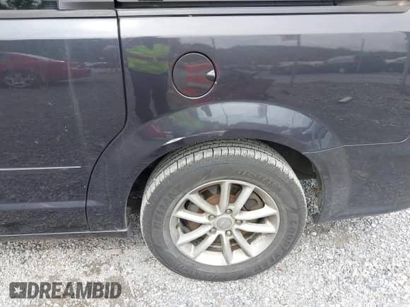 2014 Dodge Grand Caravan SXT with VIN 2C4RDGCG9ER245423, listed as a IAAI auction lot 43340034 with 228,584 mi miles and . Bid and sale history available at DreamBid. Image 6.